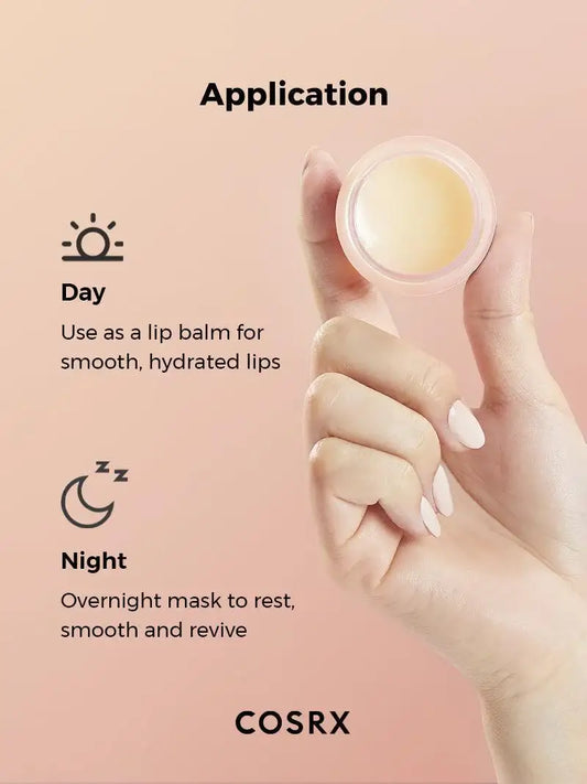Hand holding COSRX lip balm jar, with day and night usage instructions on peach background.