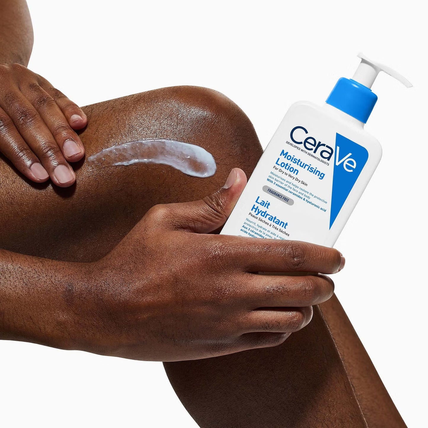 Hand applying CeraVe Moisturising Lotion to leg for dry skin hydration