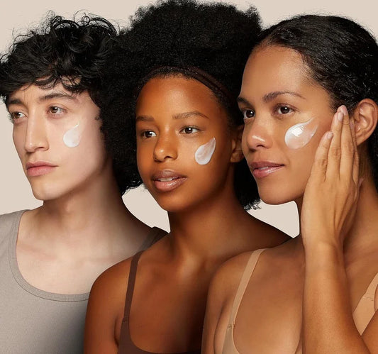 Three diverse models applying skincare cream to their cheeks, promoting healthy glowing skin