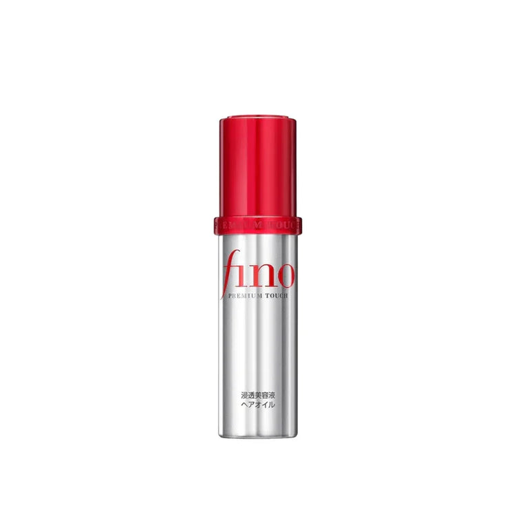 Fino Premium Touch hair oil bottle with red cap and silver body on white background