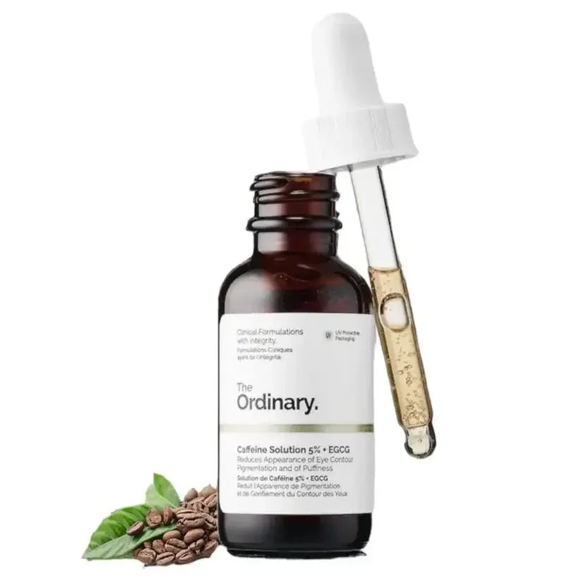 The Ordinary Caffeine Solution 5% serum bottle with dropper and coffee beans, skincare product