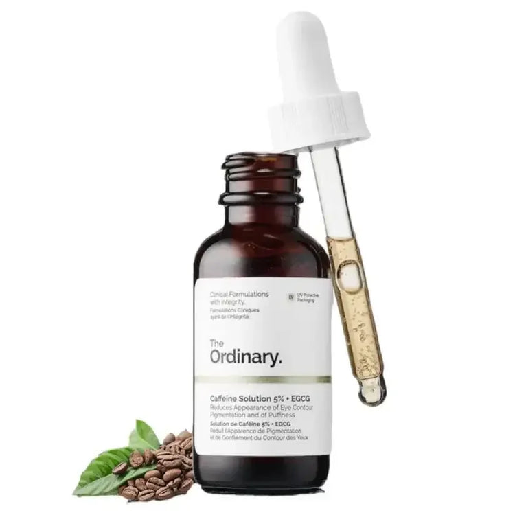 The Ordinary Caffeine Solution 5% serum bottle with dropper and coffee beans, skincare product