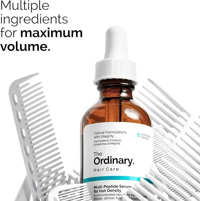 The Ordinary Hair Care serum bottle with dropper, surrounded by hair combs for hair volume.