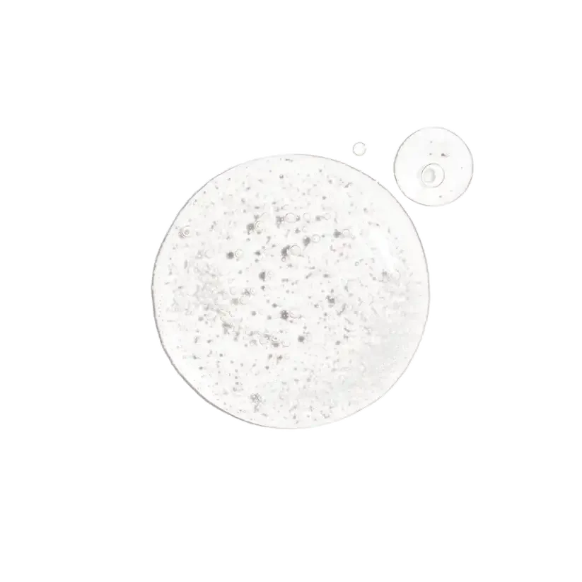 Clear skincare serum or gel texture with visible bubbles and particles on a white background