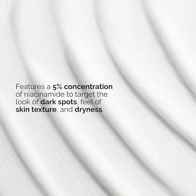 Texture of white skincare cream with text highlighting 5% niacinamide for dark spots and dryness