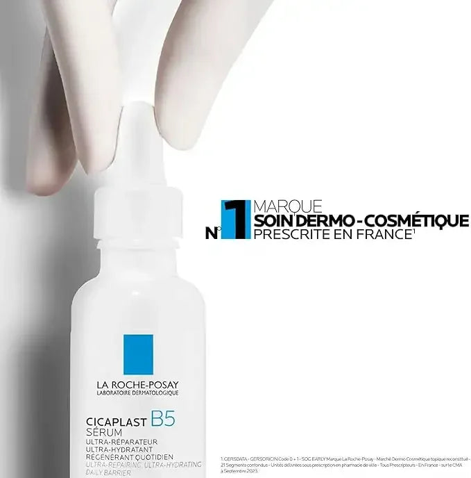 La Roche-Posay Cicaplast B5 Serum white dropper bottle with gloved hand, skincare product