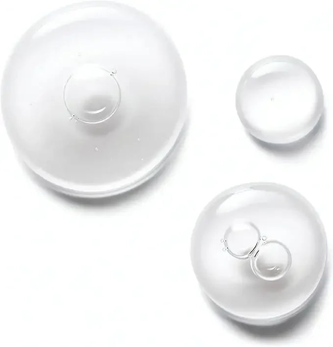 Clear skincare serum drops on a white background for beauty and hydration