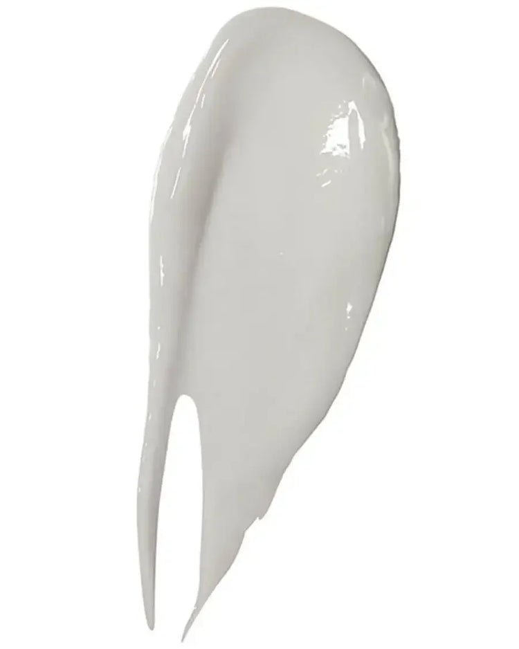 Close-up of a creamy white skincare product texture on a white background
