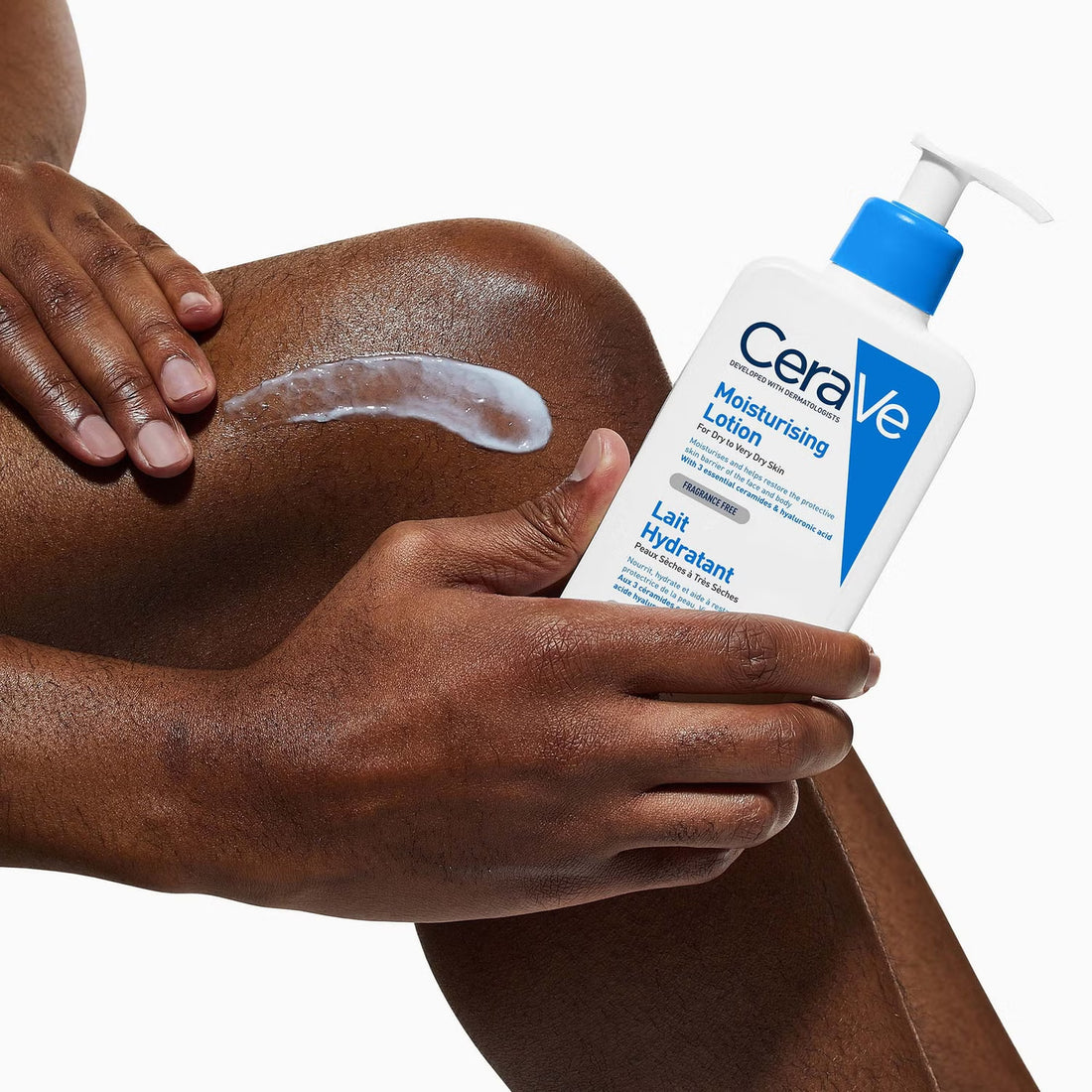 Hand applying CeraVe Moisturising Lotion to leg for dry skin hydration