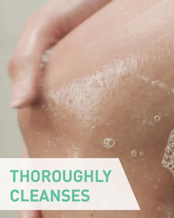 Hand washing soapy skin, skincare cleansing, with text 'thoroughly cleanses' overlay