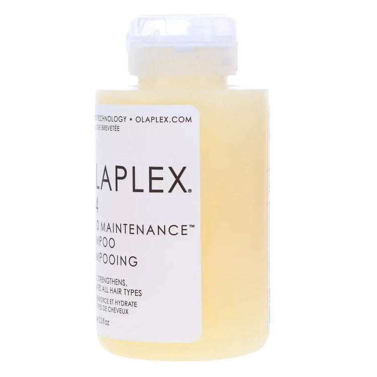 Olaplex No.4 Bond Maintenance Shampoo bottle with white label and translucent yellow liquid