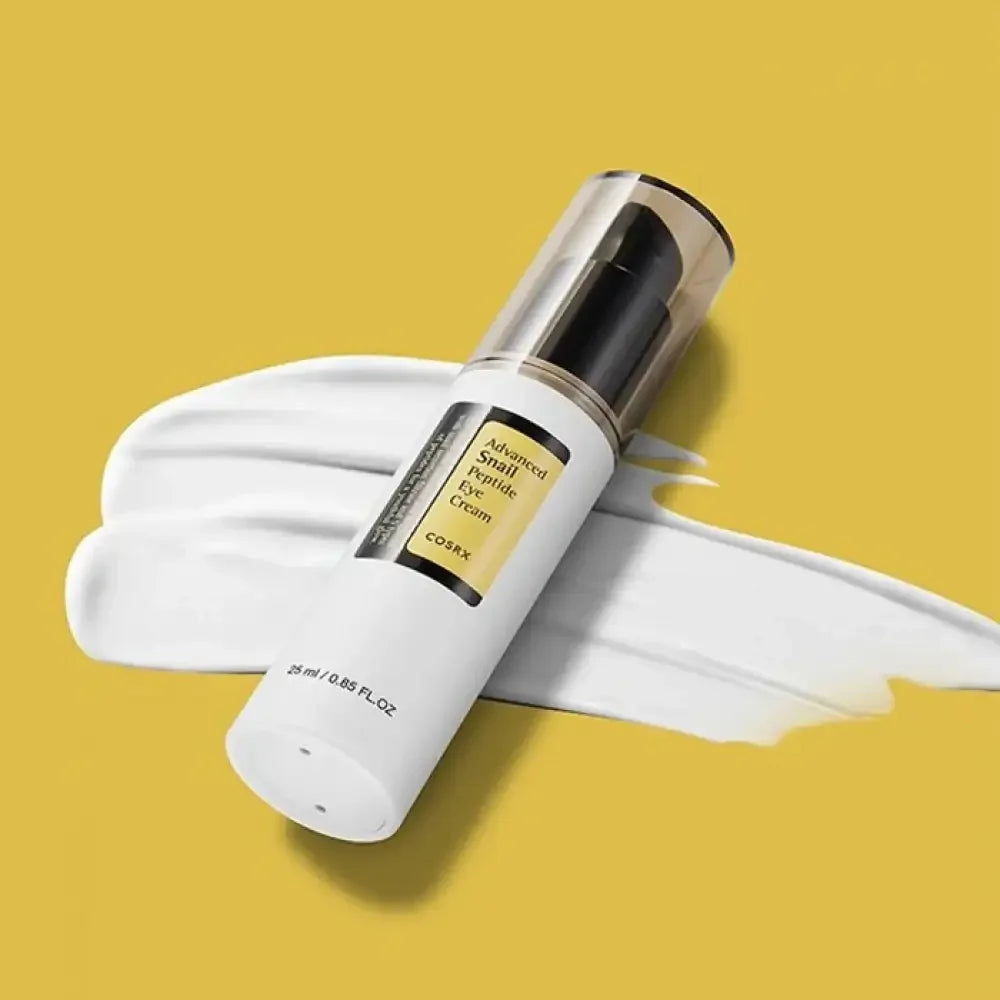 COSRX Advanced Snail Peptide Eye Cream bottle on yellow background with cream texture