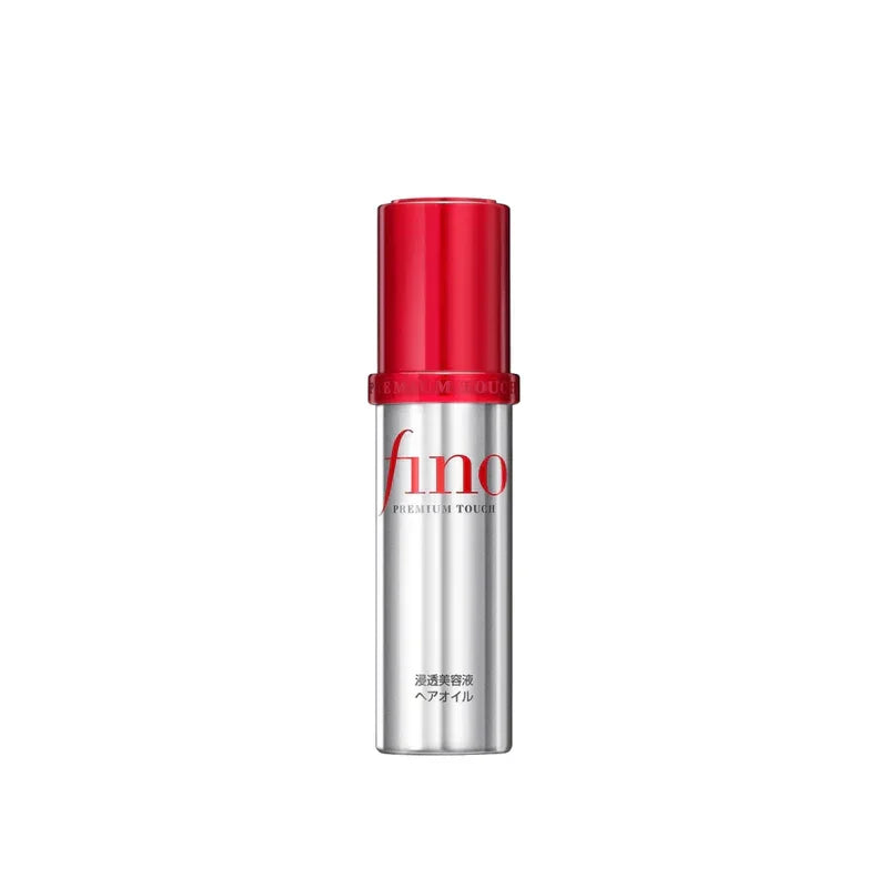 Fino Premium Touch hair oil bottle with red cap and silver body on white background