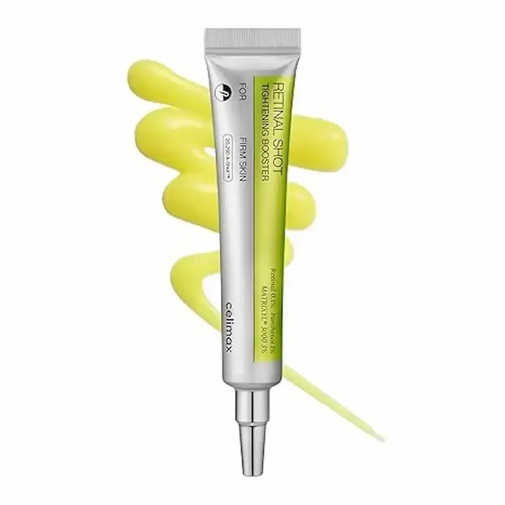 Skincare serum tube with yellow liquid on a white background