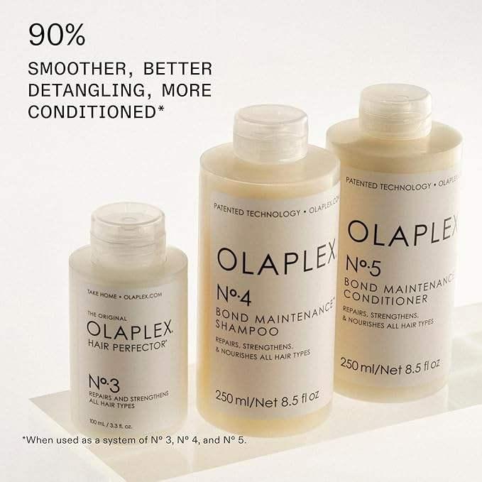 Olaplex No.3 Hair Perfector, No.4 Bond Maintenance Shampoo, and No.5 Conditioner bottles for hair repair and strengthening