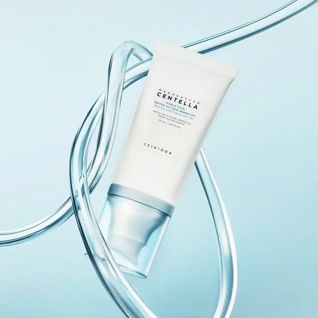 SKIN1004 Centella Hyalu-Cica Water-Fit Sun Serum SPF50 in sleek tube on light blue background
