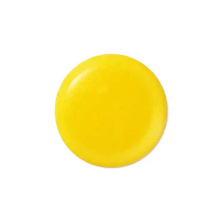 Bright yellow skincare serum texture drop on white background